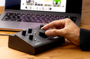 microAUDIO722_computer_with_a_hand.webp